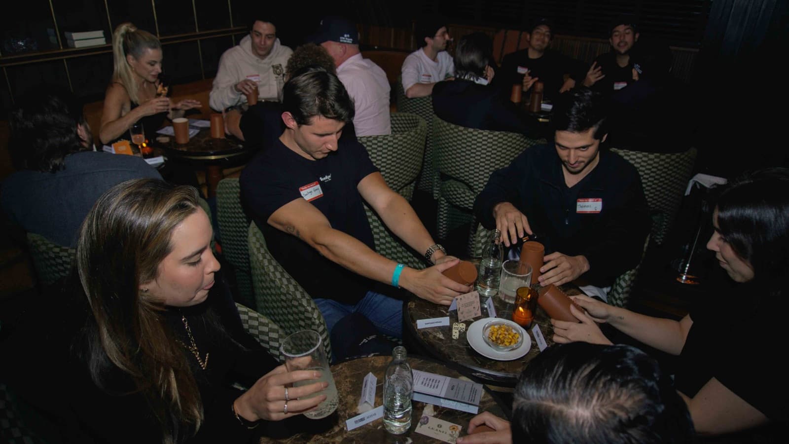 Founders playing cacho at a Pygma night in Bogotá