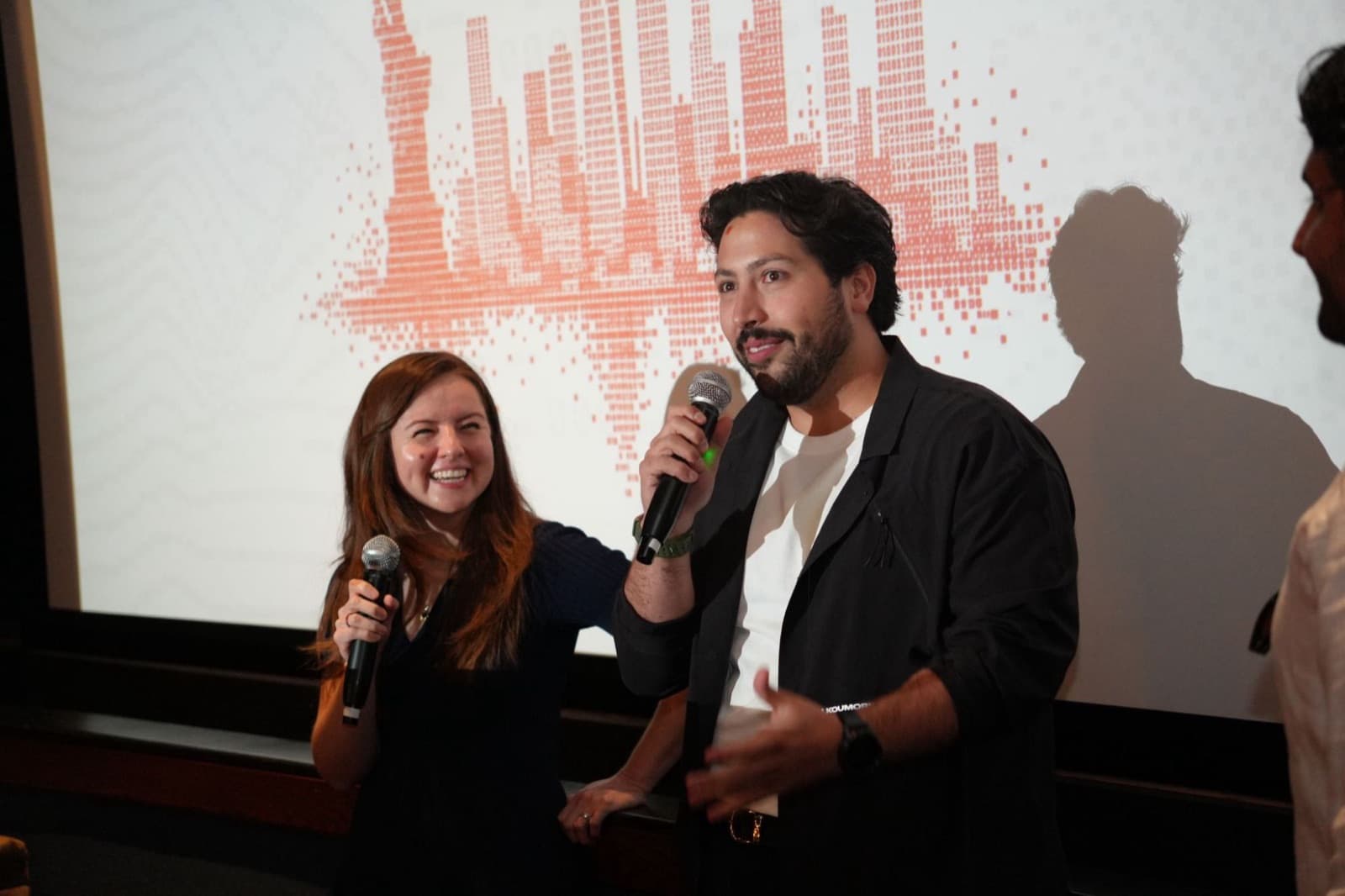 Hosts speaking on stage
